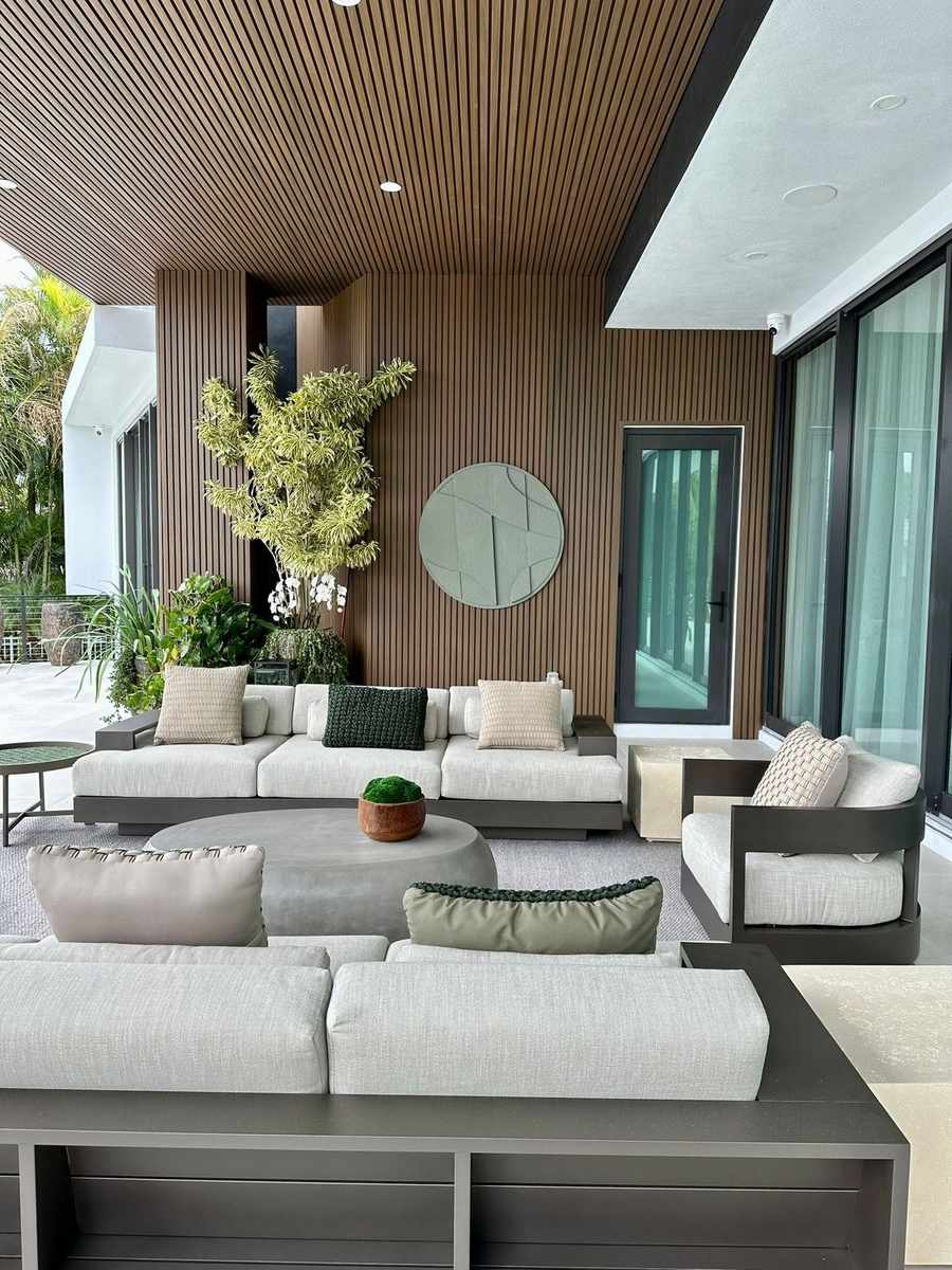 Timber-slat exterior cladding on a modern home with a lounge terrace